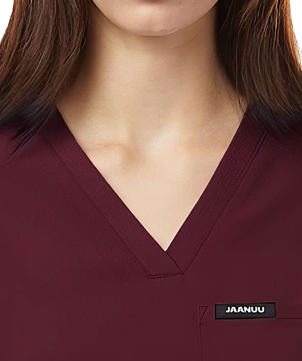 Jaanuu Women's Rhena Essential One-Pocket V-Neck Scrub Top - Embroidered